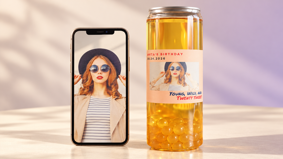 “Personalised Tempo birthday can beside a phone displaying the portrait used on its label.”